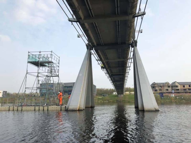 View beneath a bridge with waterside access structure on the River Tees